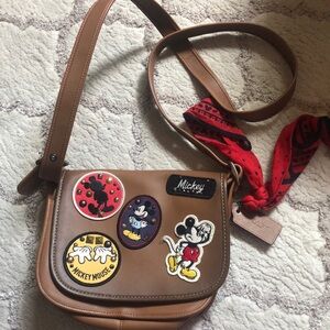 Coach Brown Leather Crossbody Bag with Unique Embellishments